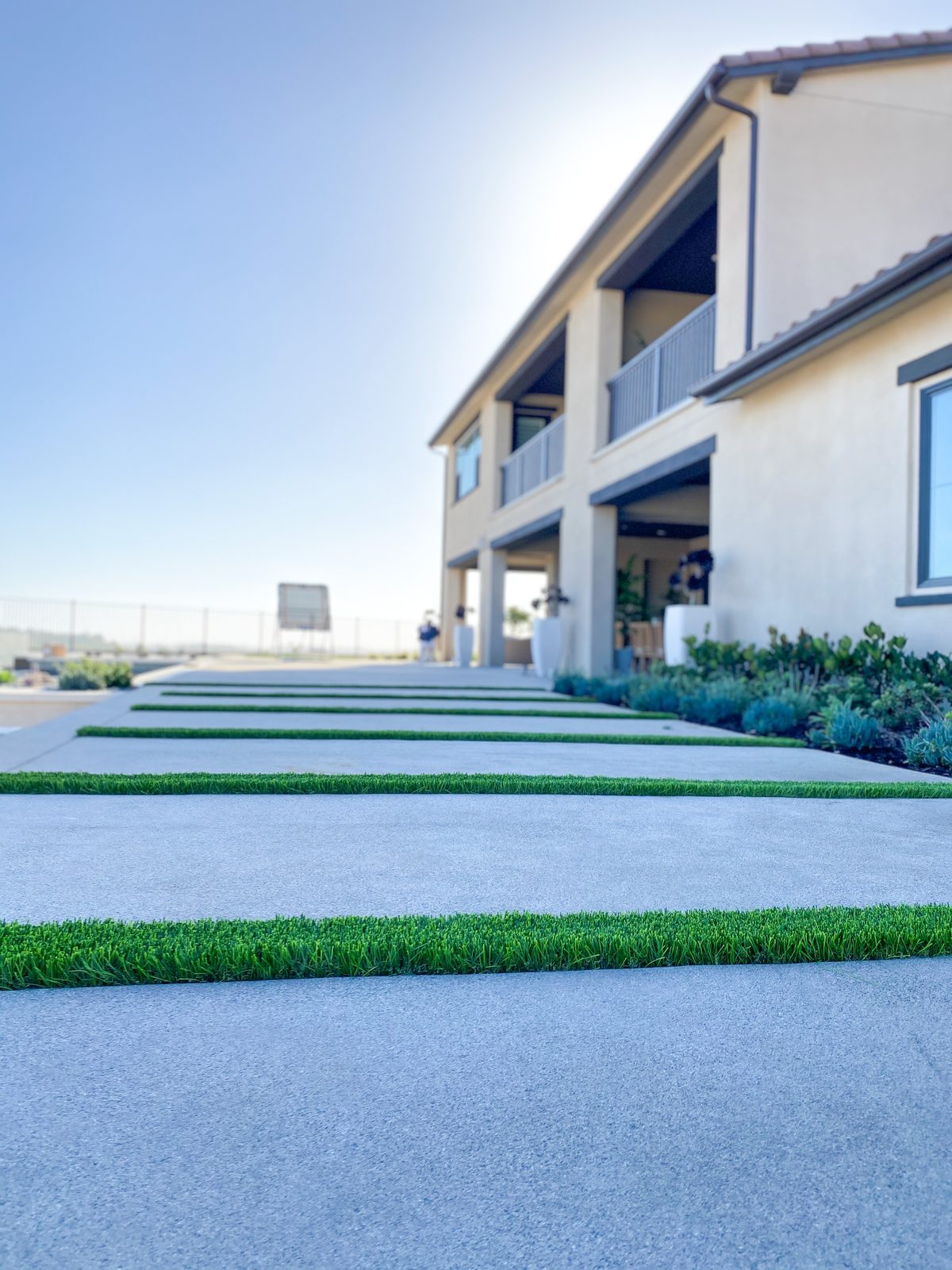 Backyard with synthetic turf and landscaping