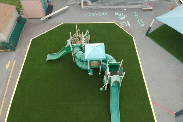 Commercial daycare playground with safety-rated synthetic turf in San Diego